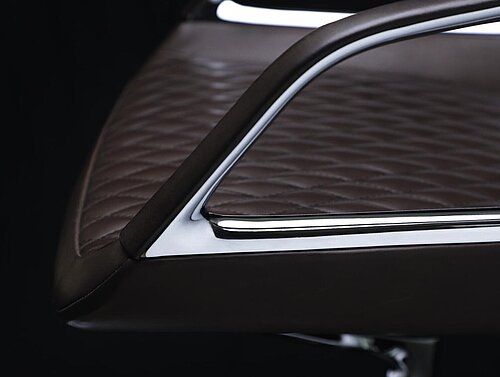Graph chair, cut-out, detail view, aluminum armrest