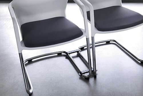 Metrik chair, cut-out, sled base detail in chrome