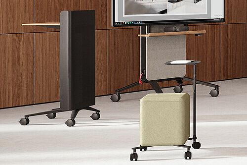 Confair Next mediawall with integrated display and shelves in front of curtains, front view