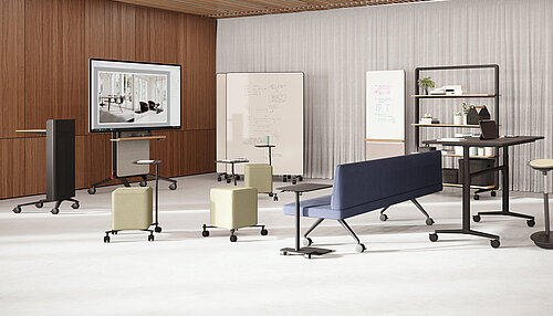 Confair Next mediawall with integrated display and shelves in front of curtains, front view