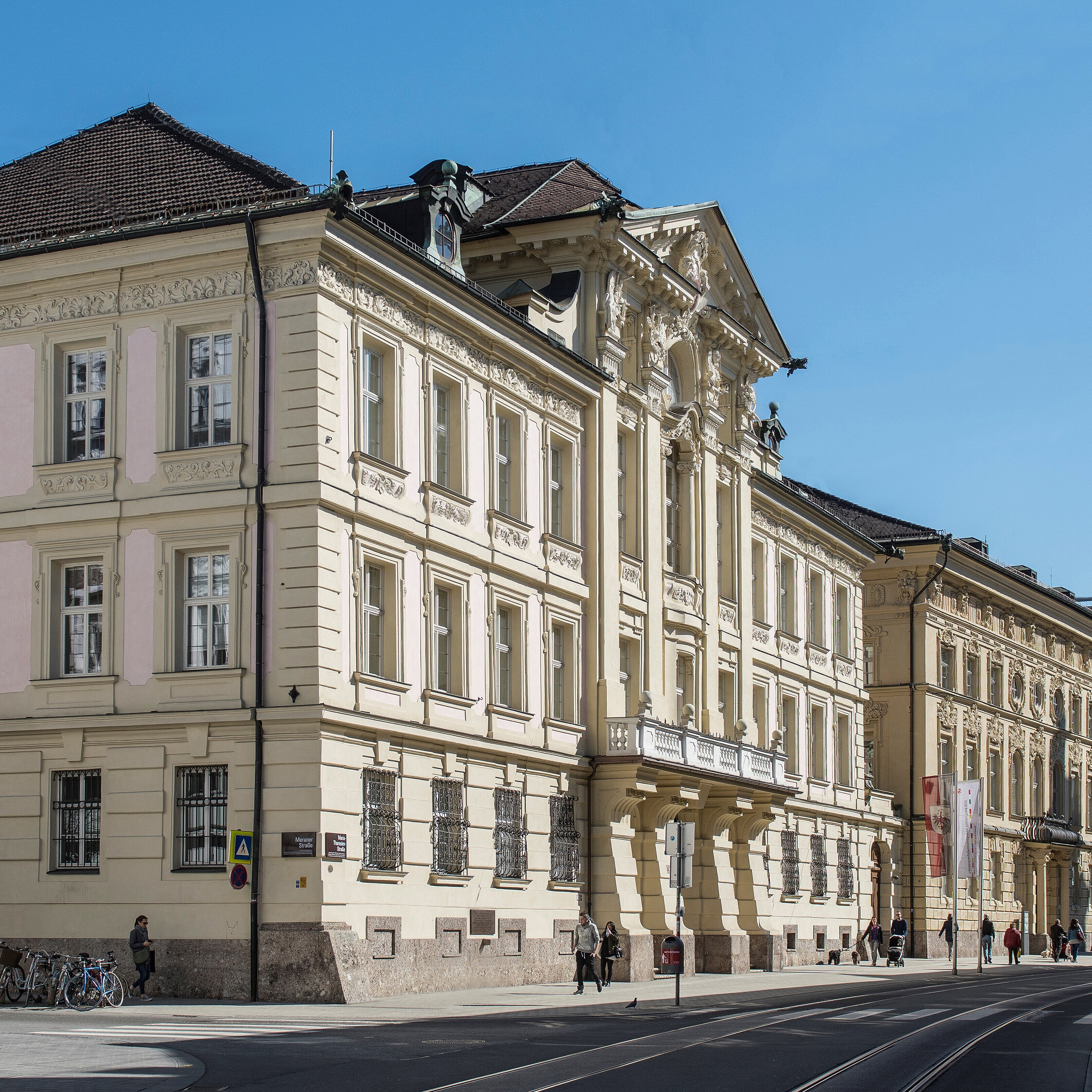 An exterior view of the Tyrolean State Parliament building. The facade is light beige and features decorative elements.