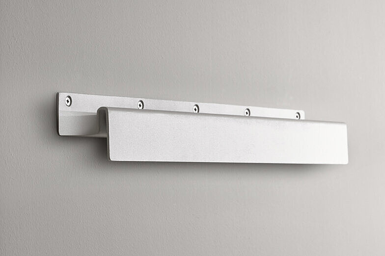 A picture of a white wall shelf.