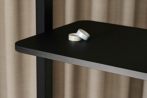 Confair Next shelving unit, detail view of black metal shelf