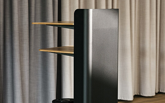 Confair Next lectern in office environment, side view with shelves