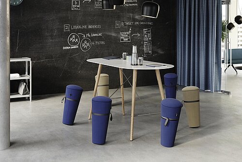 Stand-up stool in creative meeting space with high table