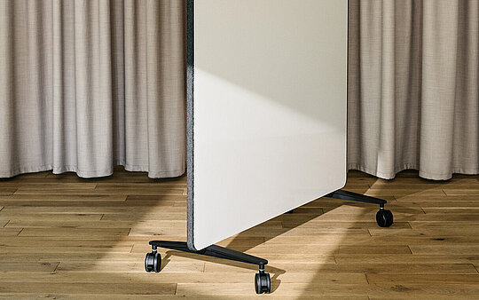 Confair Next mobile whiteboard in studio setting, angled front view