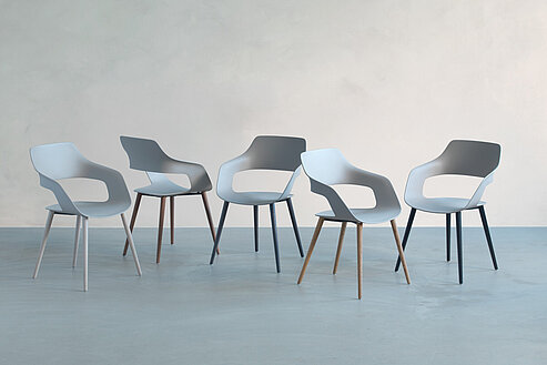 Occo Wooden-Legs chairs in minimalist studio setting, product family overview