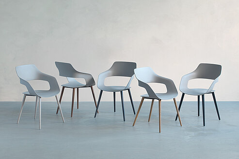 Occo Wooden-Legs chairs in minimalist studio setting, product family overview