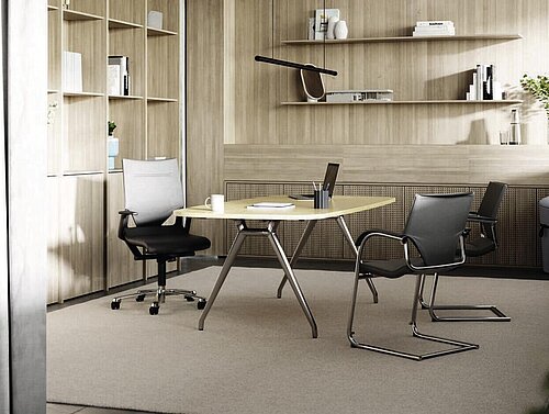 Versa table in compact meeting room with shelving