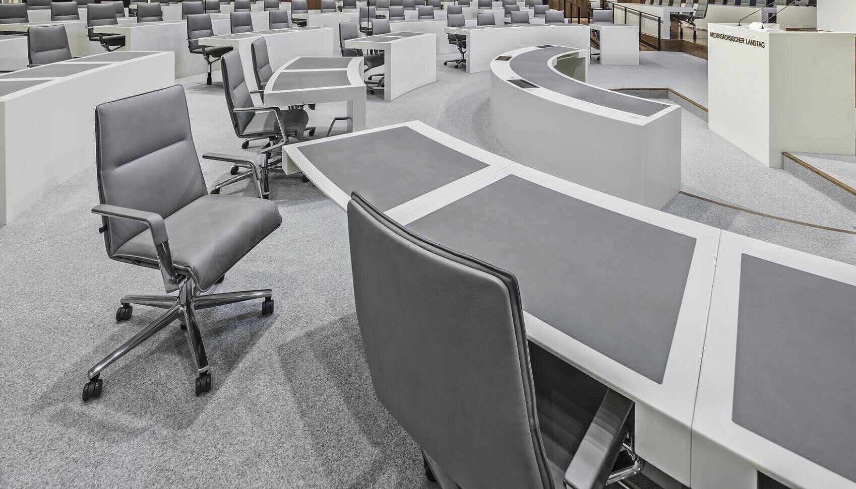 Sola chair in parliamentary chamber, seating arrangement scene