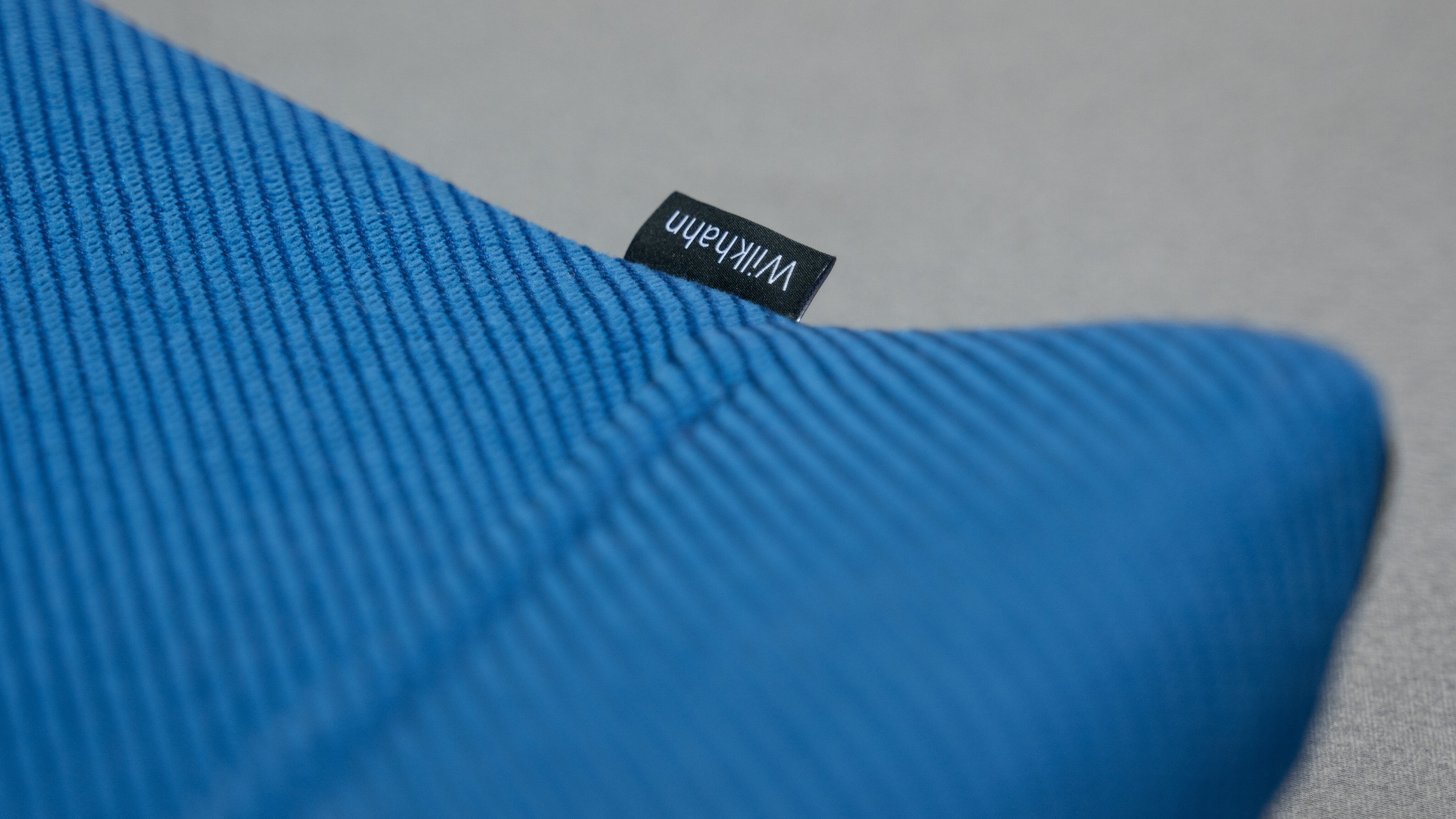 A close-up of a blue seat pad.