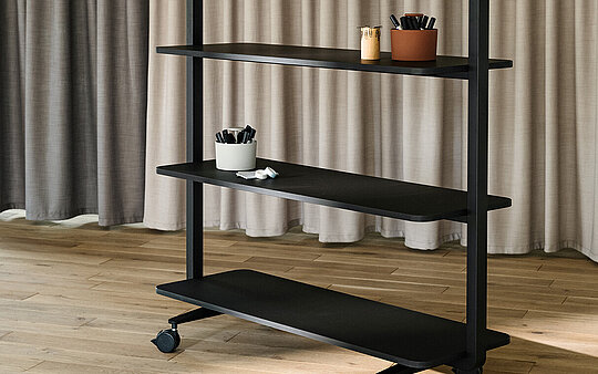 Confair Next mobile shelving unit in studio setting with accessories
