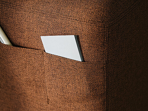 Confair Next upholstered rolling stool detail with document pocket