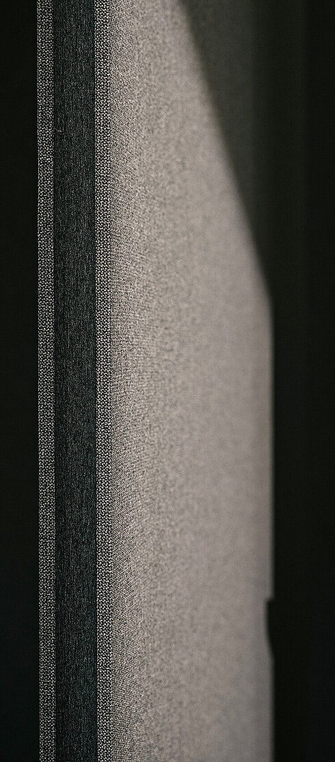 Confair Next, detail of fabric panel edge with felt trim