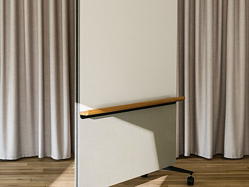 Confair Next mobile whiteboard in studio setting, angled front view
