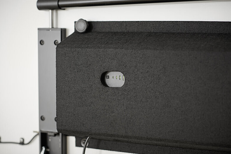 A black felt cover to conceal and house the technical components of the timetable.