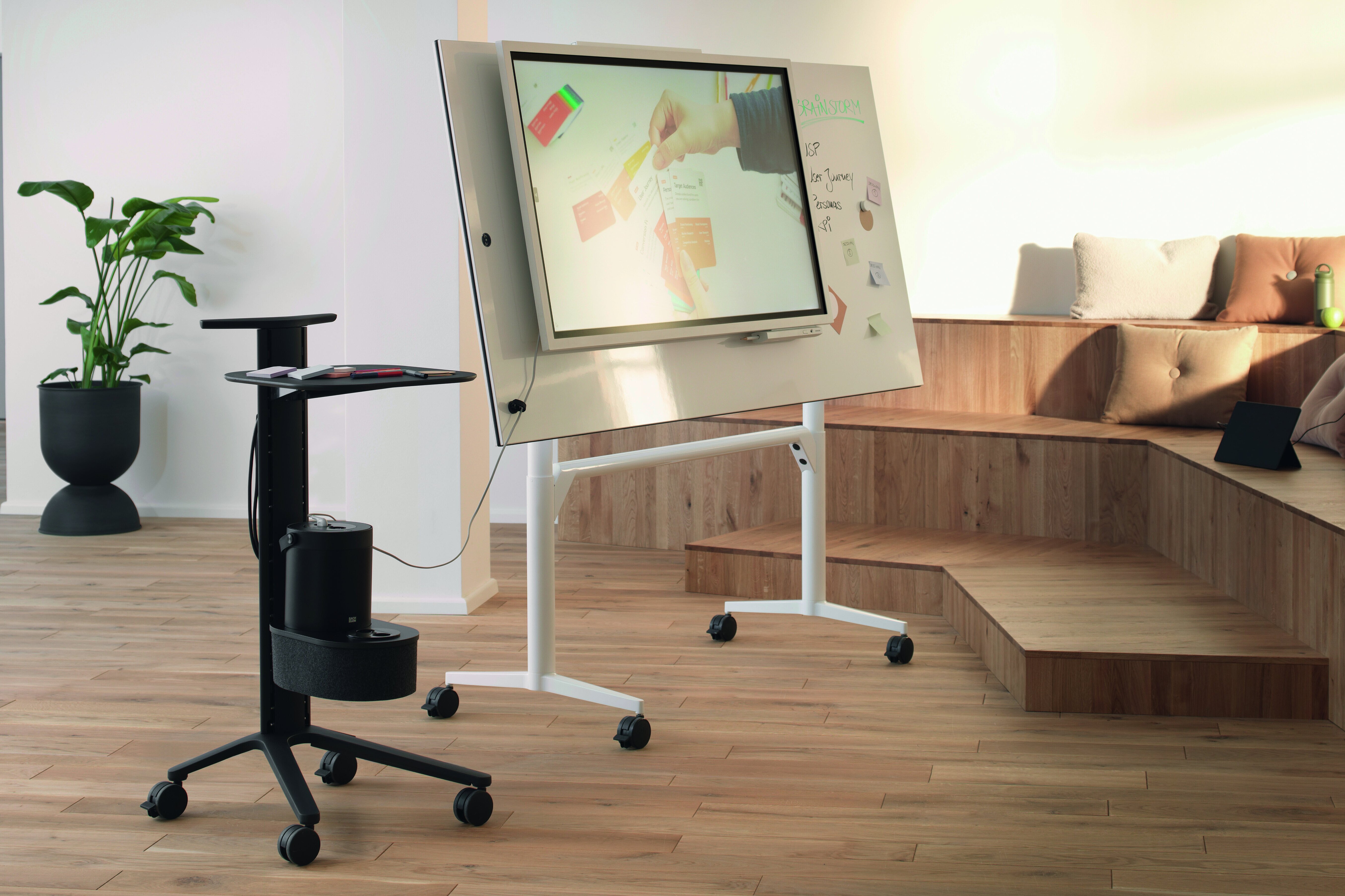 Timetable lift table in agile workspace, group discussion scene