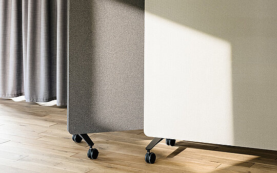 Confair Next mediawall, close-up of perforated panel with wooden shelf, detail view