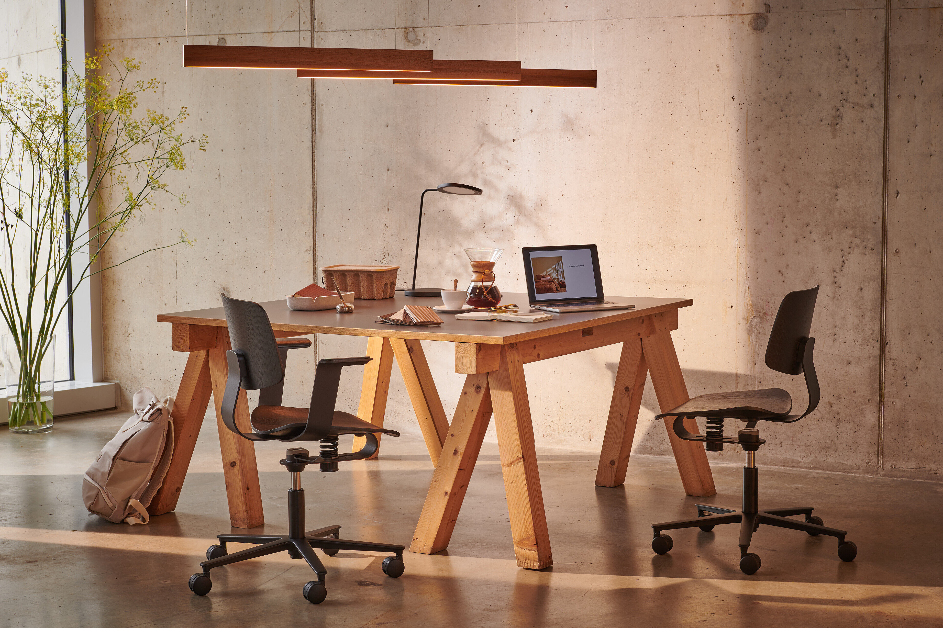 Wichair chairs at wooden worktable, studio workspace scene