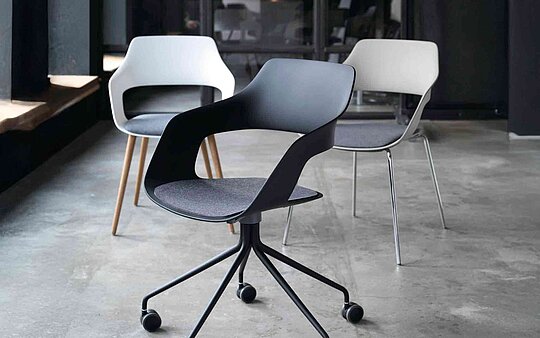Occo chair in industrial interior, lounge seating scene