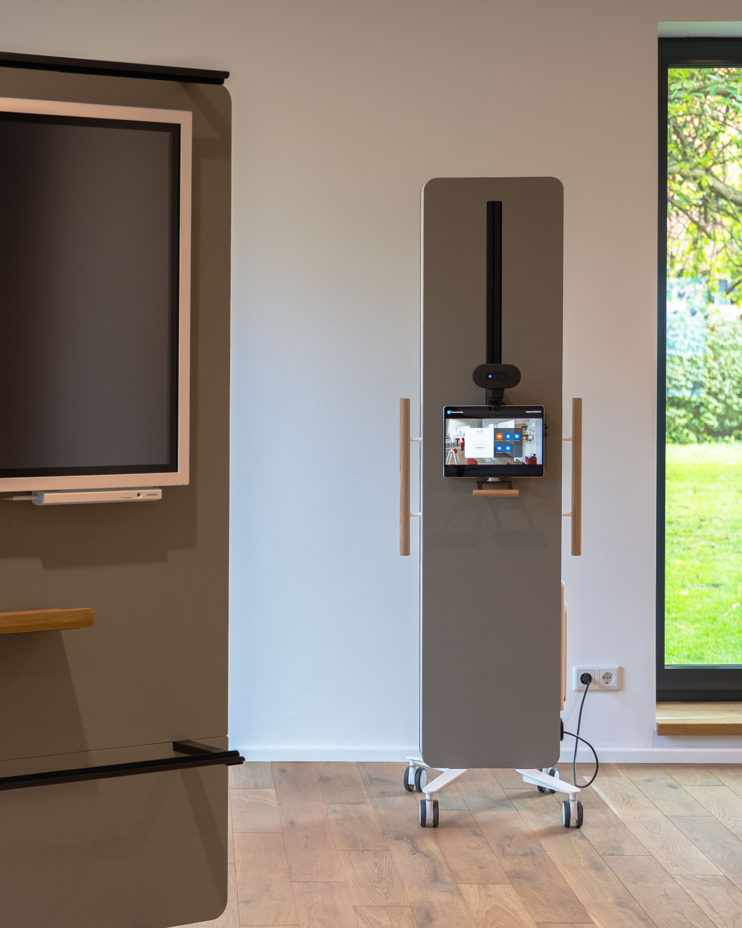 It is a close-up of two display racks. One is only partially visible, while the other is visible in its entirety. Both have a white frame and a beige back panel.